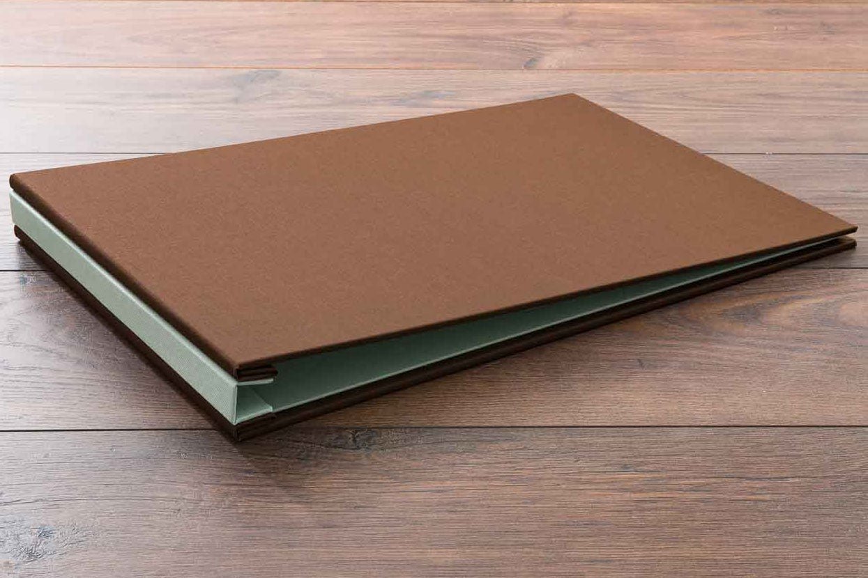 11x17 portfolio book. Product is H&Co hidden screw post binder in Darling brown book cloth