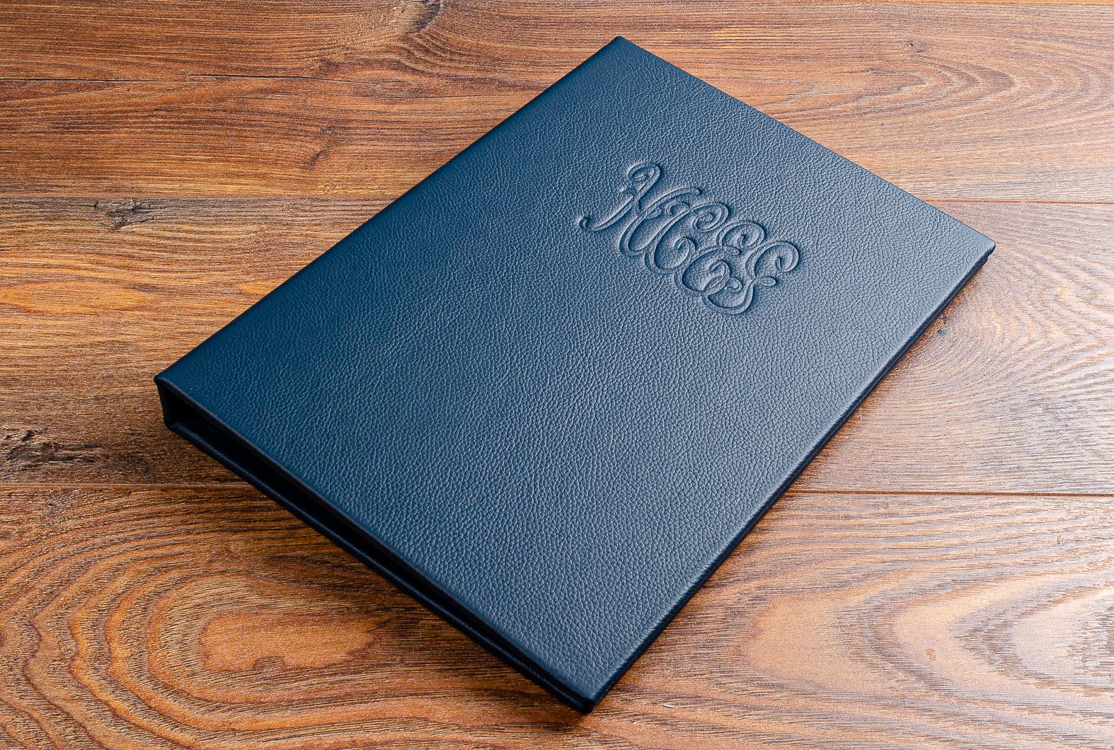 finest quality luxury leather menu with personalized embossed logo on cover