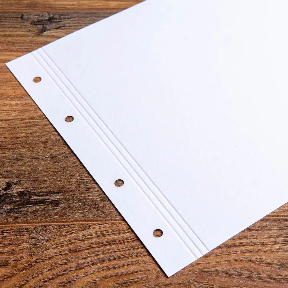 Close up of A4 Landscape 175gsm Paper pre Punched and Scored and scored along the margin for bespoke presentation binders by Hartnack and Company.
