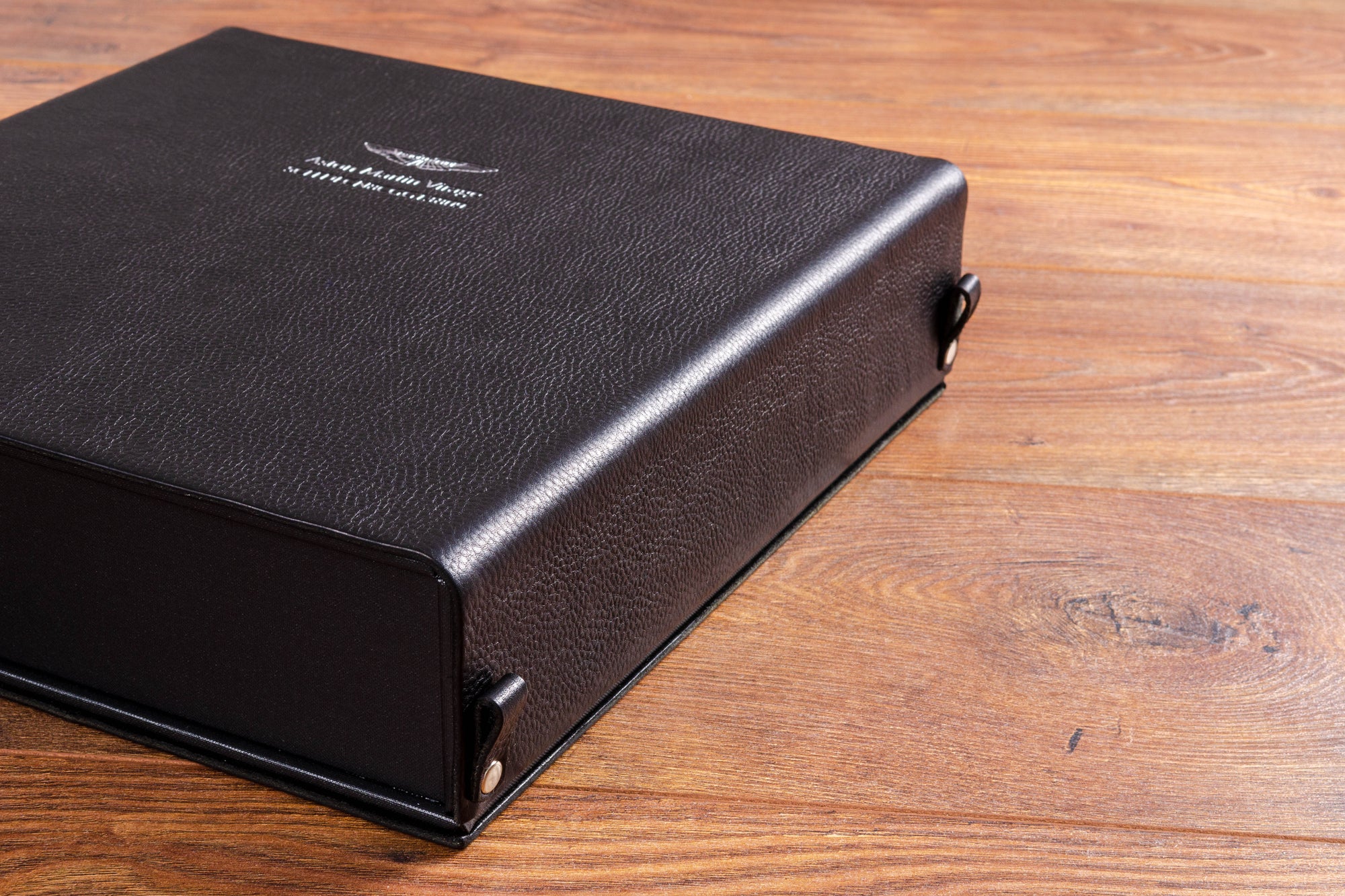 Black leather box binder for Aston Martin Racing vehicle documents 