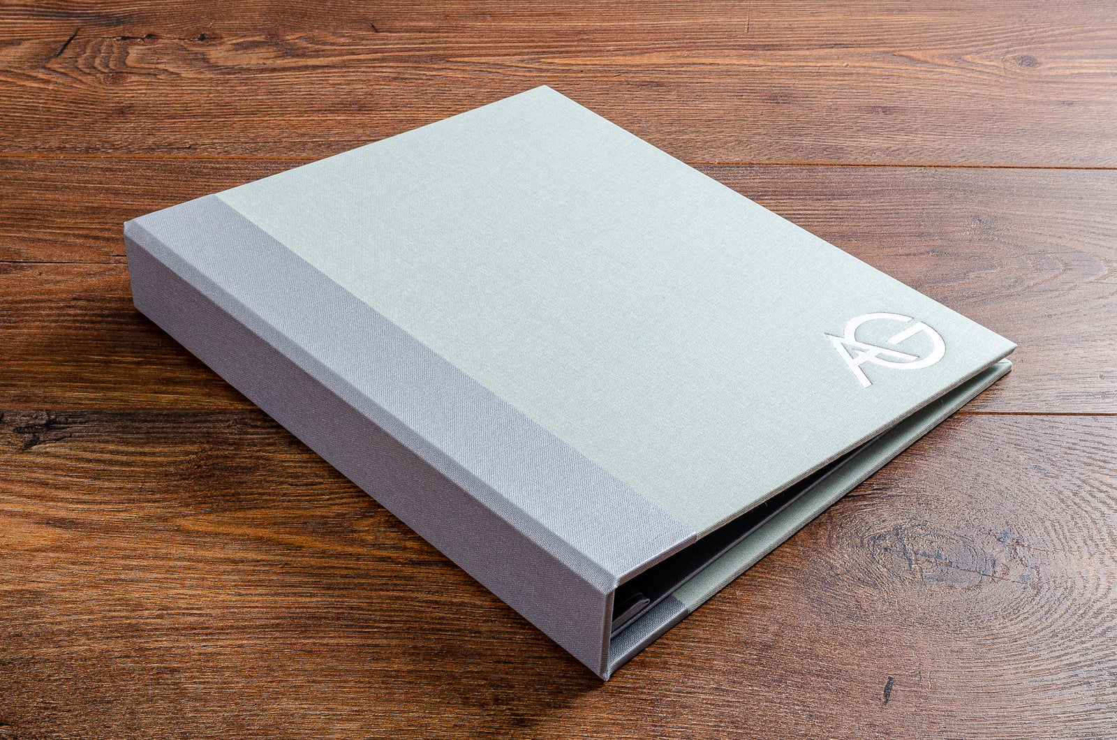 11x14 screw post portfolio book with platinum silver spine cover and Lichen green cover with silver foil stamping