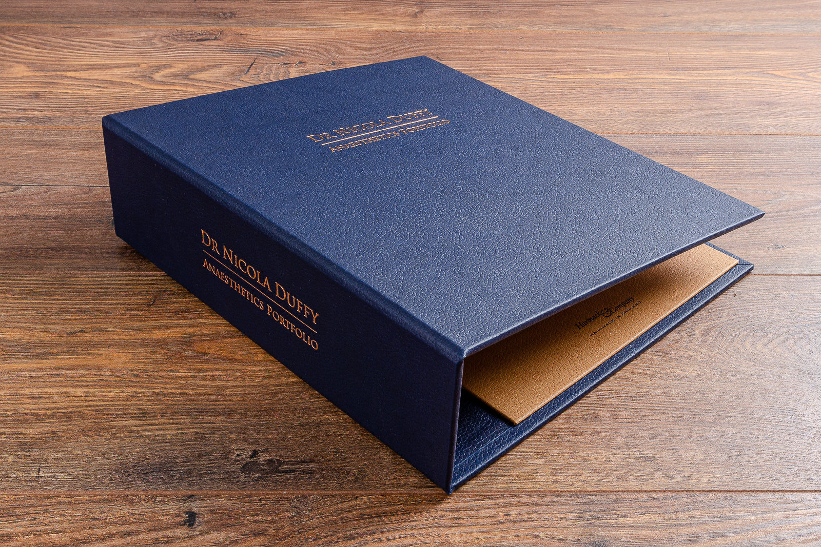 Personalised Anaesthetists medical portfolio in blue faux leather with copper foil personalisation on the cover and spine 