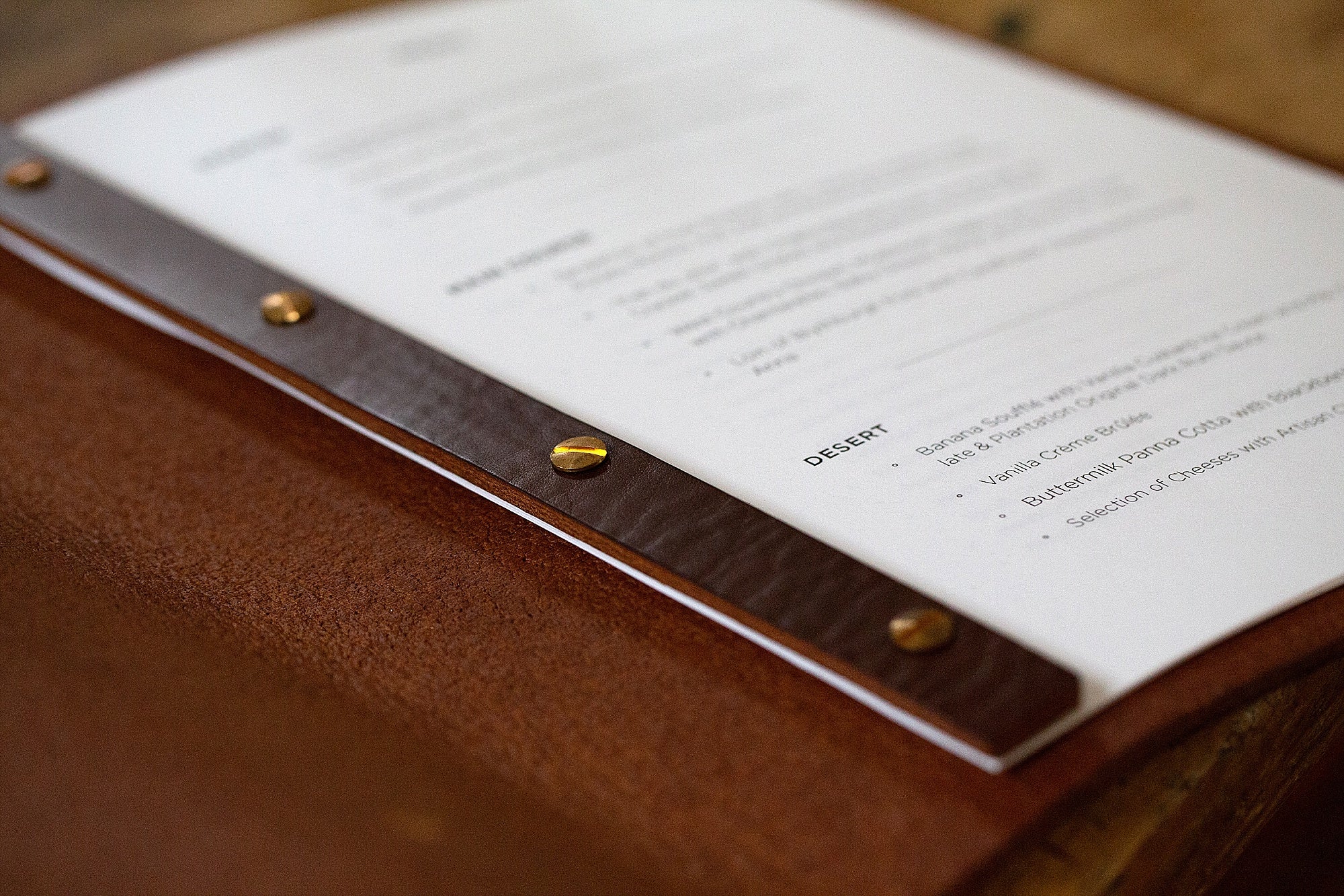menu page fixing detail on leather screw post binder