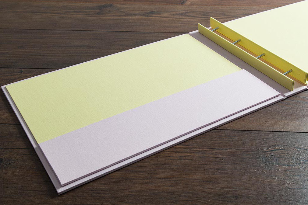 Screw post portfolio book in Citrus yellow and Calamine white