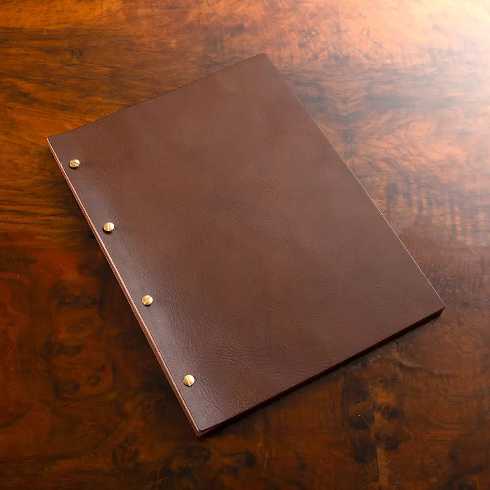 Leather Exposed Screw Post Binder in brown veg tan leather with brass screws for a luxury presentation binder.