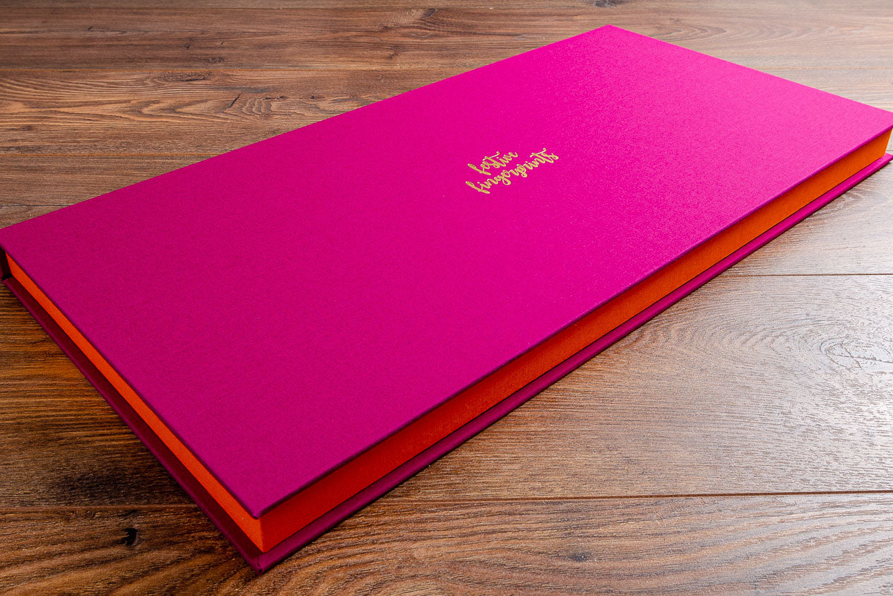 Custom made presentation clamshell box in Exe pink book cloth with gold foil personalised embossing on cover