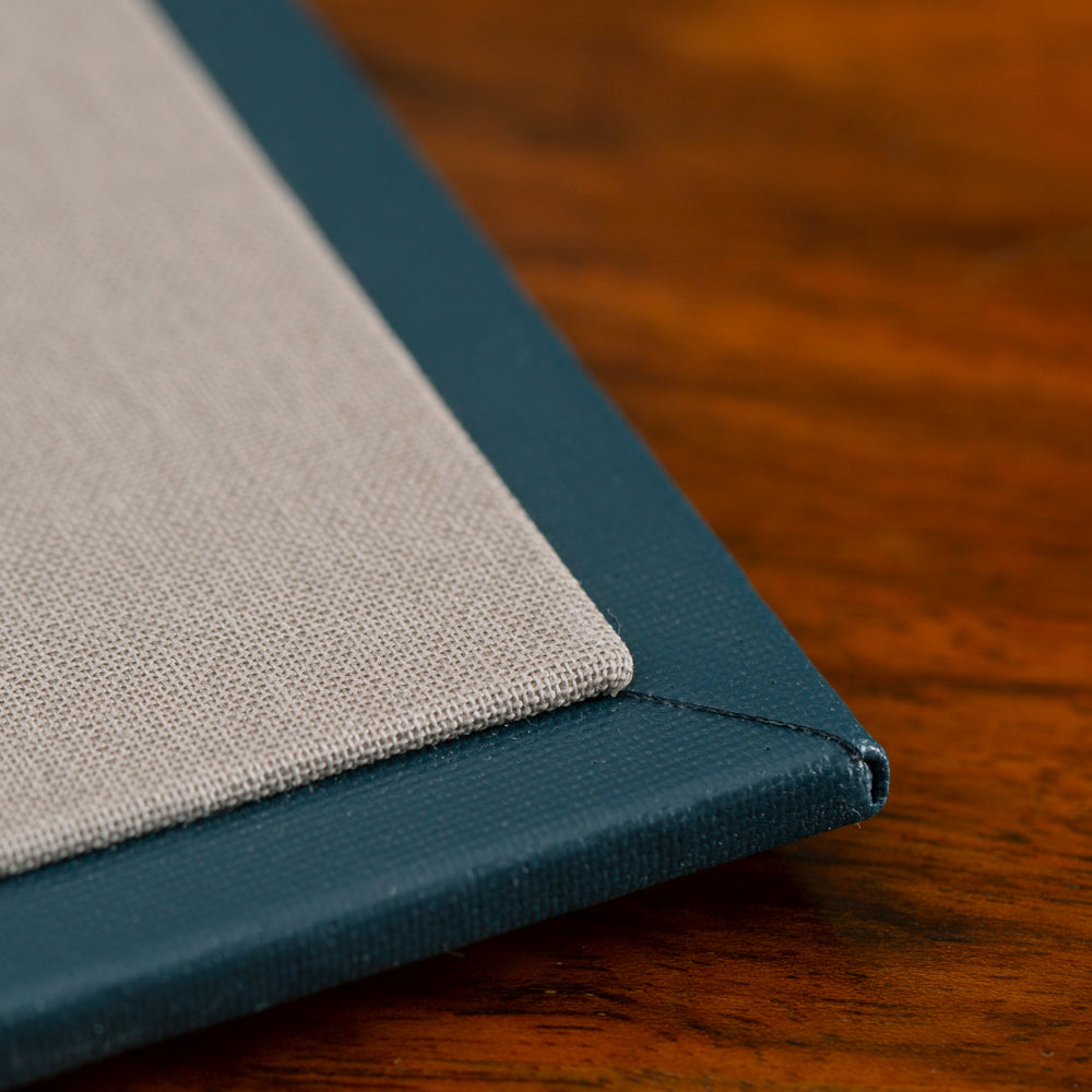 Hidden Screw Post Binder close-up showing luxury bespoke cover materials and expert craftsmanship by Hartnack and Company.