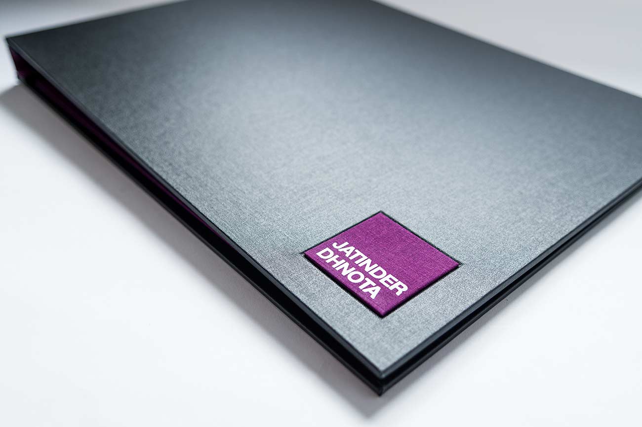 Personalised name plaque in Harlech purple book cloth on design portfolio book