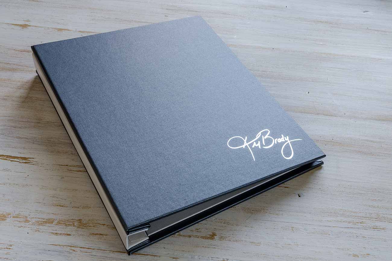 A4 hidden screw post portfolio book in pewter grey buckram and silver foil personalisation