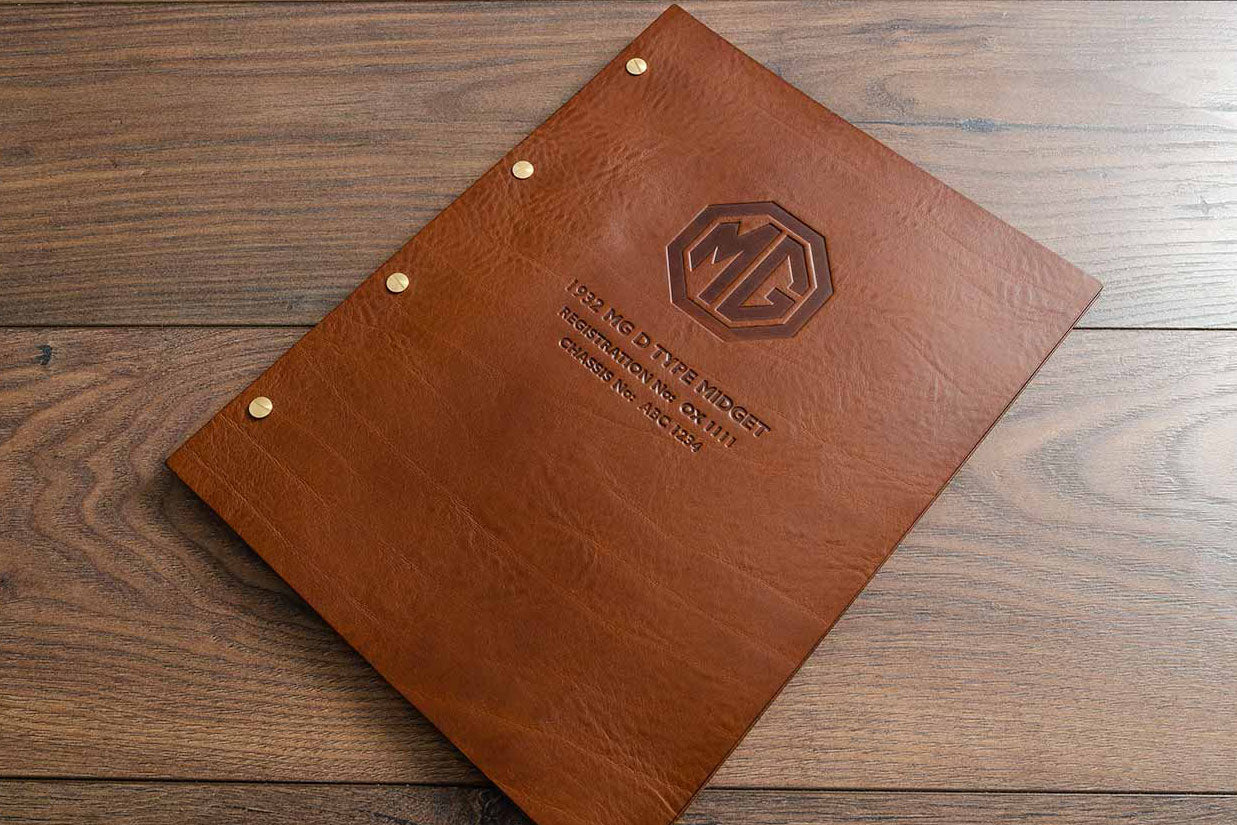 Embossed leather binder for vehicle documents