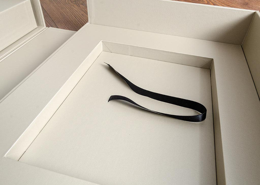 Recess in custom made presentation box with pull ribbon.