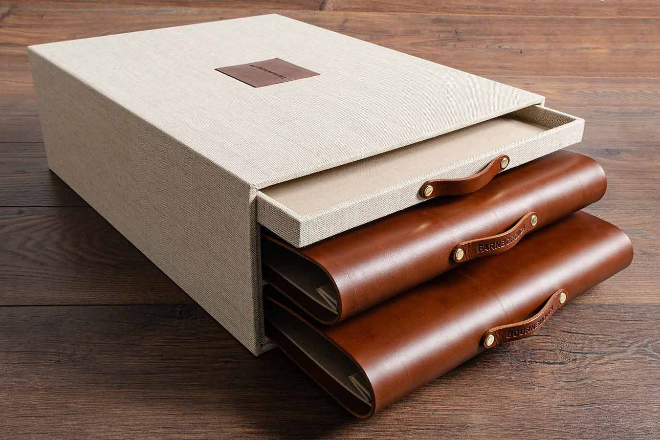 Bespoke presentation box and binders. Product is triple slipcase with drawer, leather name plaque on top and two leather screw post presentation binders with personalised leather pulls