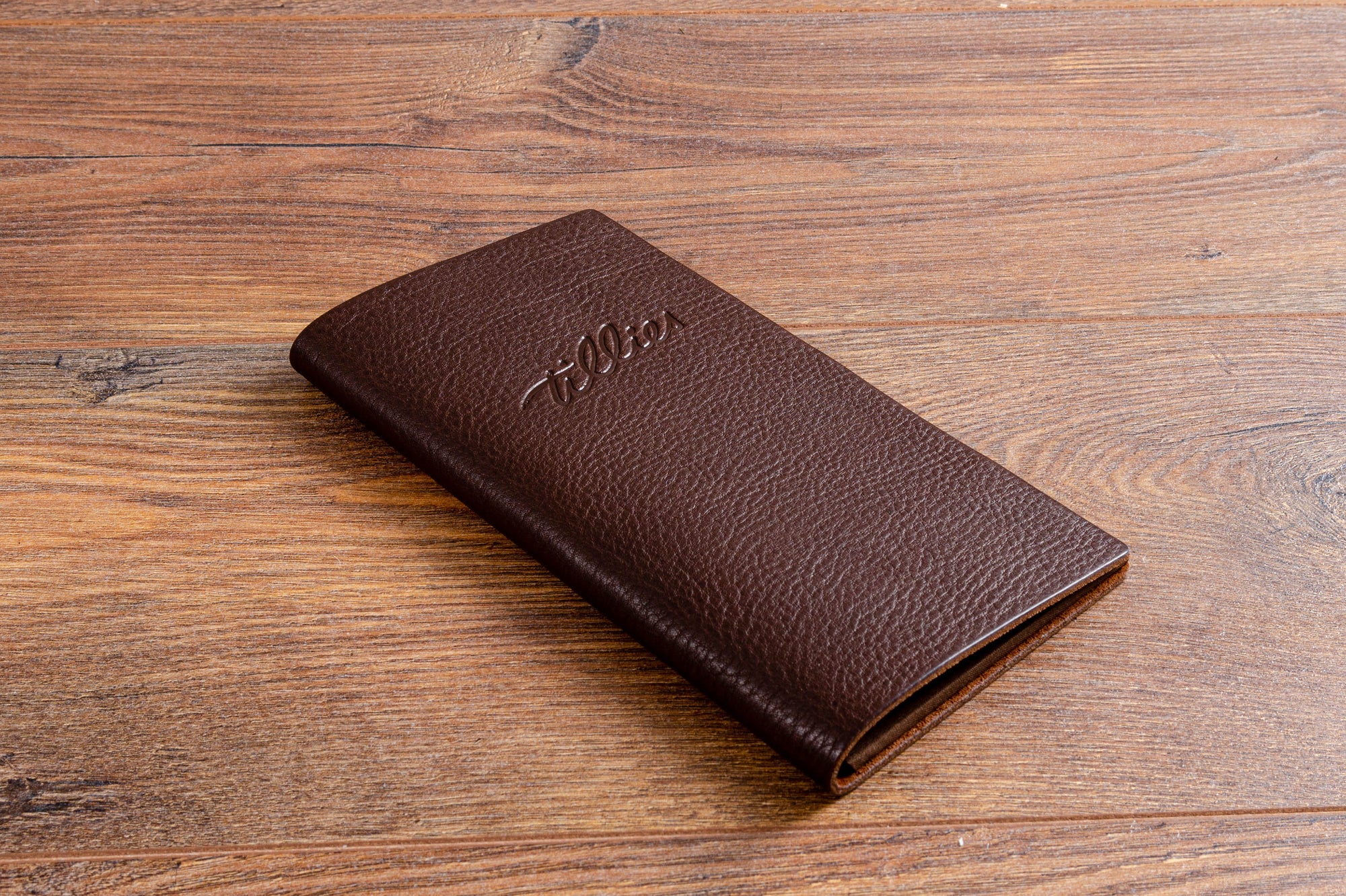 Brown leather cheque and bill presenter with personalised cover