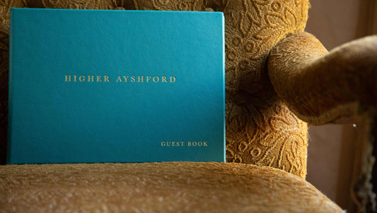 Luxury custom made A4 leather guest book in teal leather with gold foil personalisation