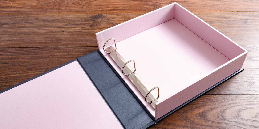 clamshell box binder with 3 ring binder mechanism in pink and platinum book cloth