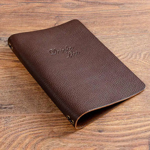 brown textured leather drinks menu with elastic strap and debossed personalised cover