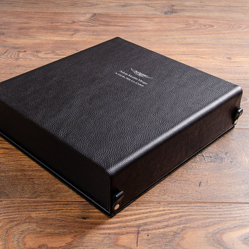 Black leather box binder for Aston Martin car history file with silver foil embossing on the cover