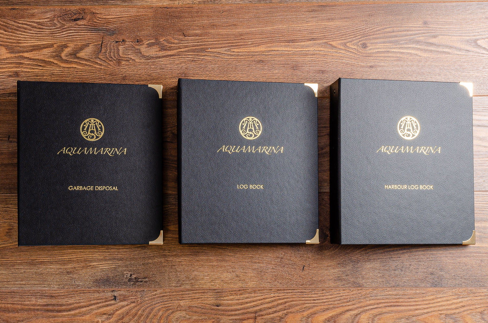 Luxury ring binders for super yacht, log book and harbour log book in faux leather with gold edgings and gold foil personalisation