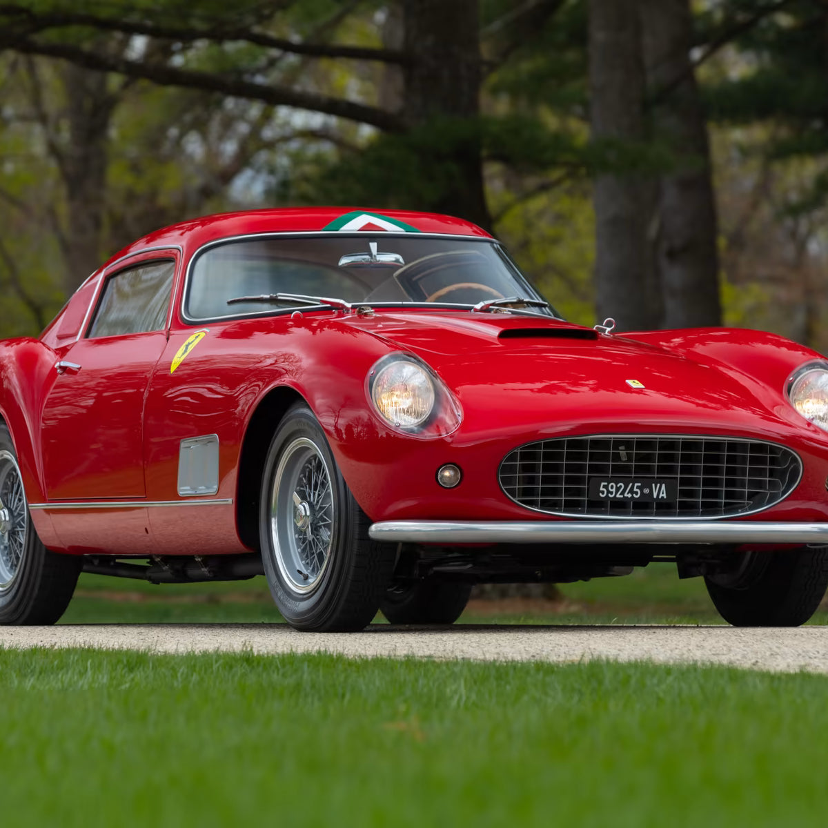 Red vintage Ferrari 250 GTO Tour De France car on a grassy area with trees in the background - Gallery image 6