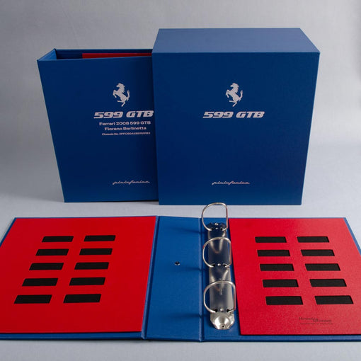 Custom made vehicle document box and binder in a blue and red box with silver foiled logo