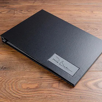 A3 black buckram photographers portfolio book with grey personalised name plaque