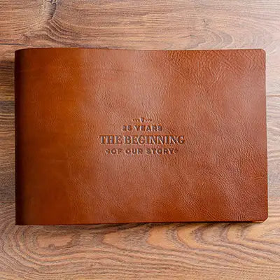 large rustic brown leather landscape anniversary album with a personalised embossed cover