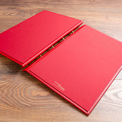 luxury A3 screw post binder lying open on a wooden background