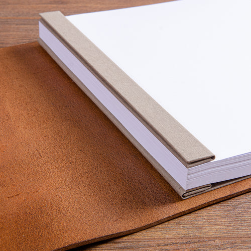 paper inserted into screw post leather album with beige cover