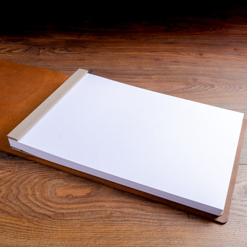 clean white A3 landscape paper inserted into screw post album