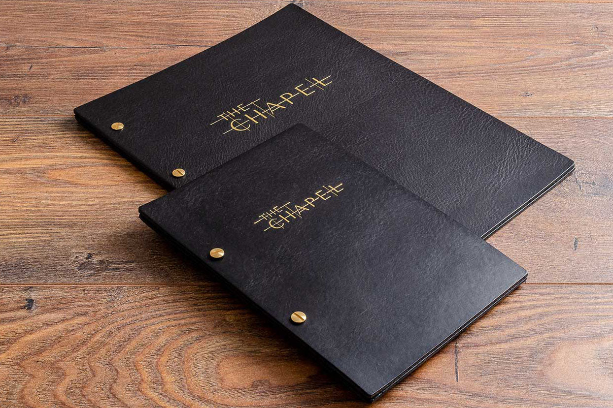 A4 and A5 black leather menu covers personalised with gold foil bebossed embossing