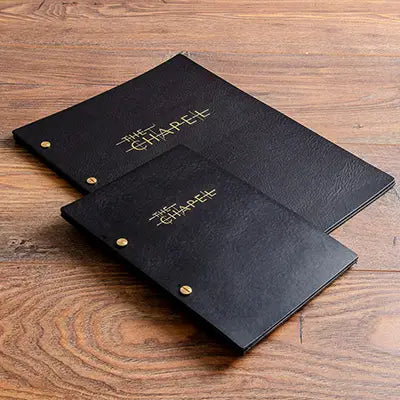 A4 and A5 black leather menu covers personalised with gold foil embossed personalisation