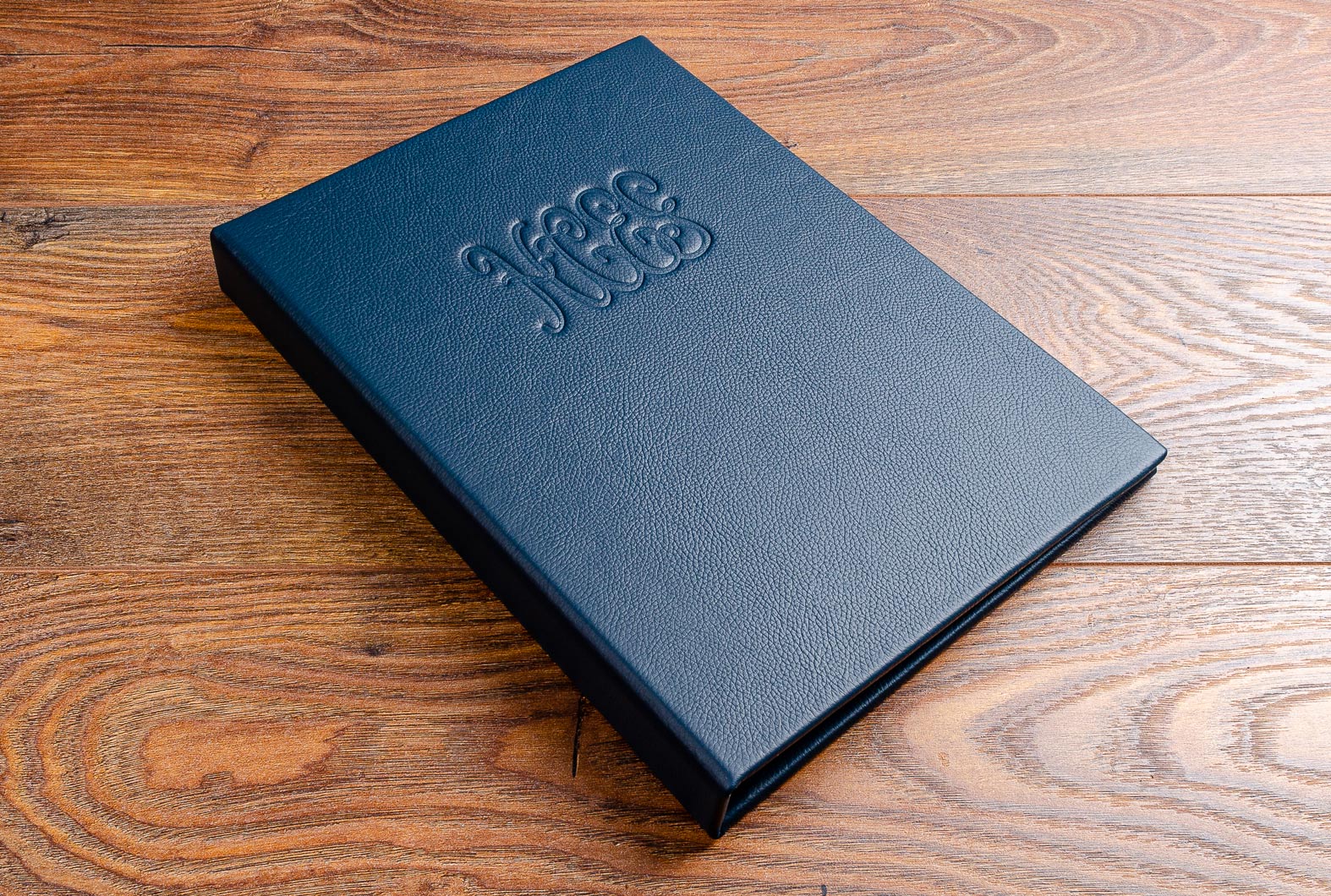 Luxury A4 leather bound menu cover with embossed perosonalised logo 