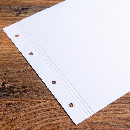 Close up of A4 Landscape 175gsm Paper pre Punched and Scored and scored along the margin for bespoke presentation binders by Hartnack and Company.