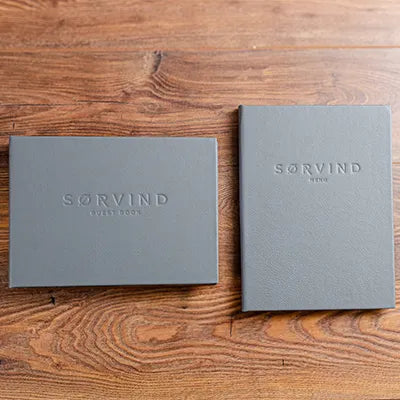 Custom made leather guest book and menu for luxury yacht with personalised embossed cover