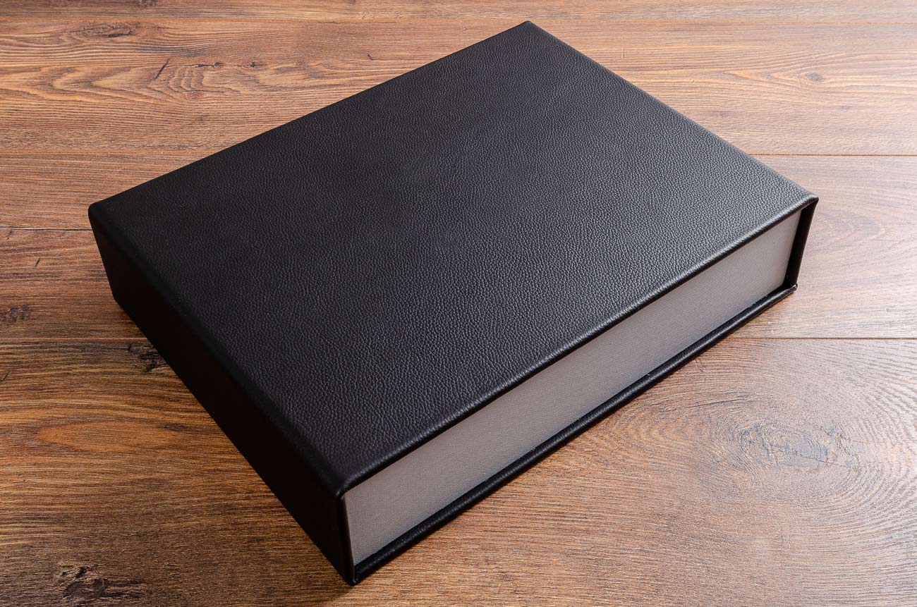 Black leather clamshell box for luxury yacht guest book