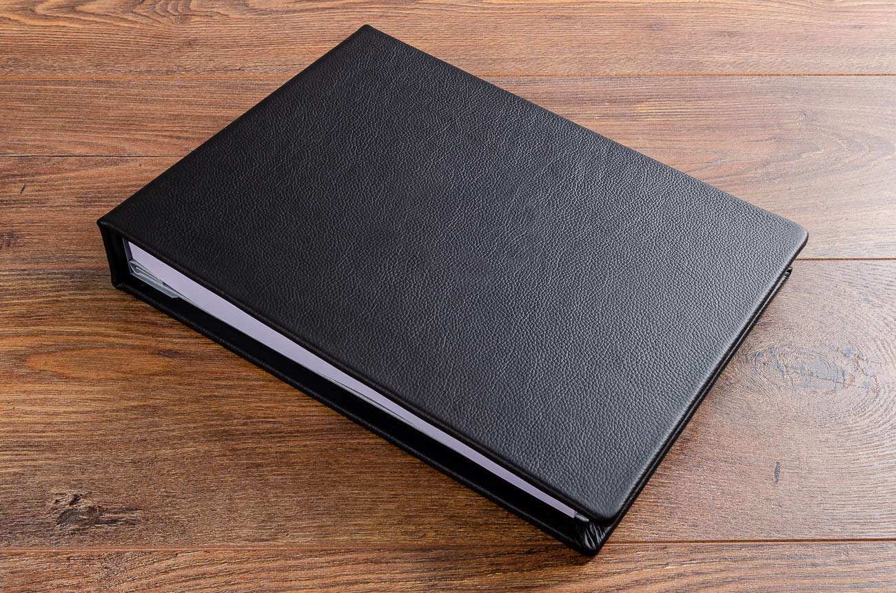 Black leather high quality hand made guest book for luxury yacht with personalised cover 