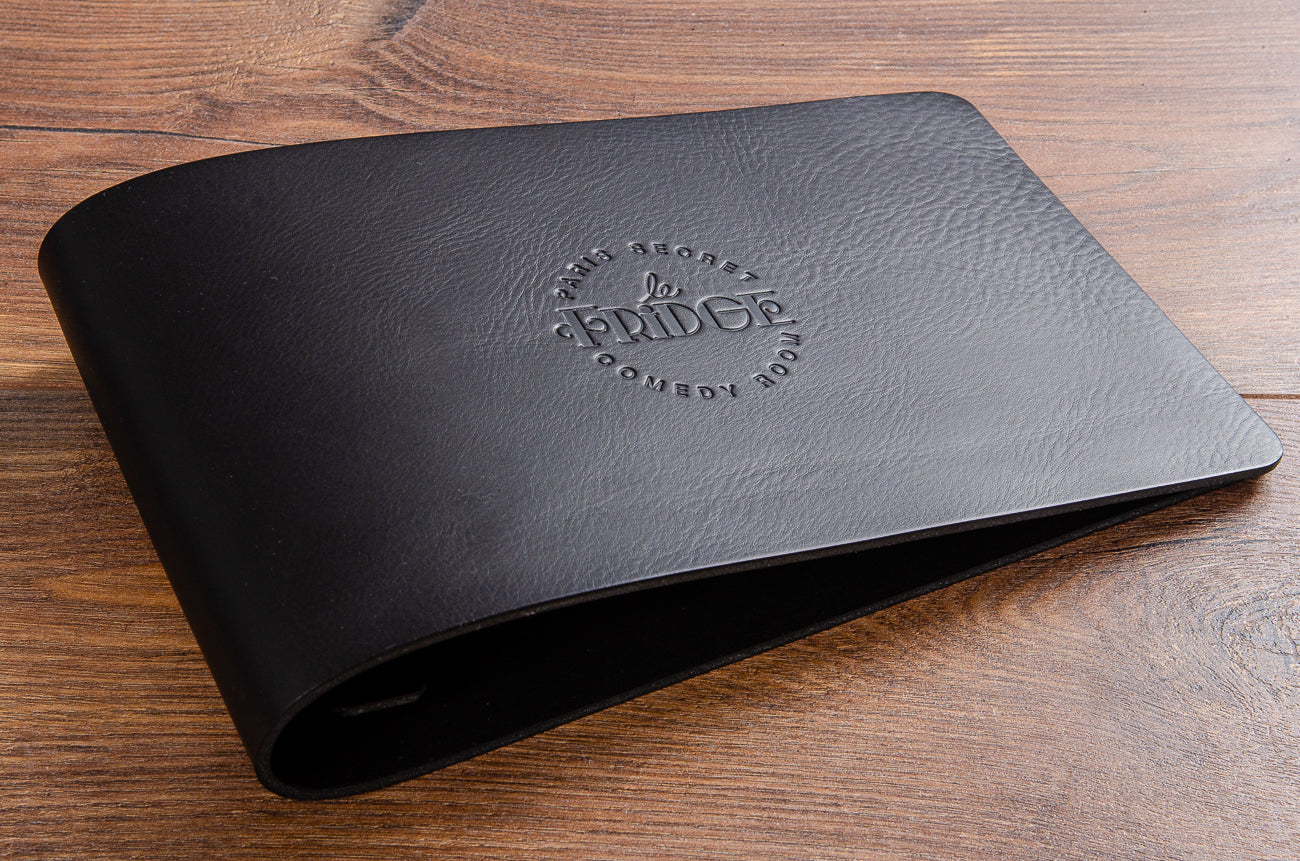 Blind embossed logo on the cover of quality black leather menu cover
