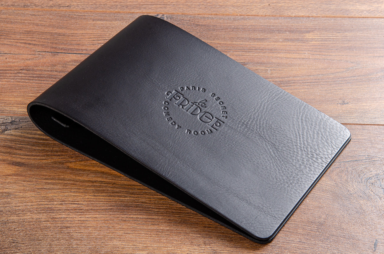 Personalised black leather menu cover with blind embossed logo on the cover
