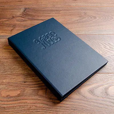 Luxury A4 leather bound menu cover personalised with embossed logo 