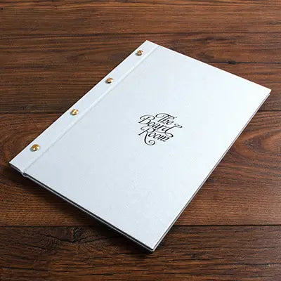 luxury silver fabric screw post menu cover with personalised embossed cover in black foil 