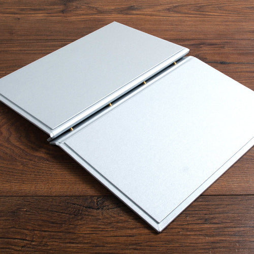 A4 luxury high quality screw post menu cover lying open on wooden boards custom made by Hartnack and co