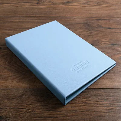 light blue leather menu cover with debossed logo engraved on the cover