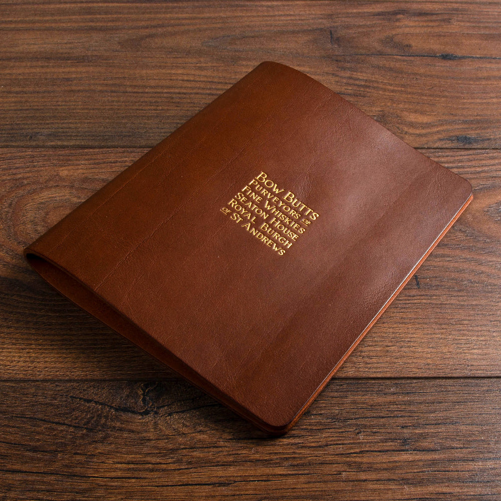 luxury brown leather menu with gold foil lettering etched into the cover by hartnack and co - Hospitality