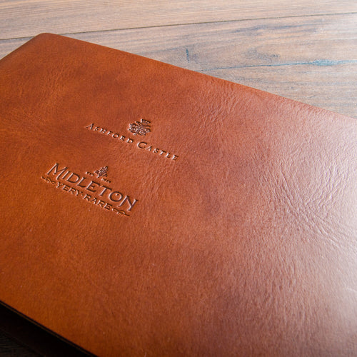 Blind embossed debossed logos on brown veg tan leather by hartnack and company