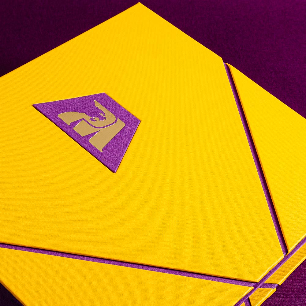 custom yellow binder cover with purple inserts and purple plaque with gold foil logo - Gallery image 5