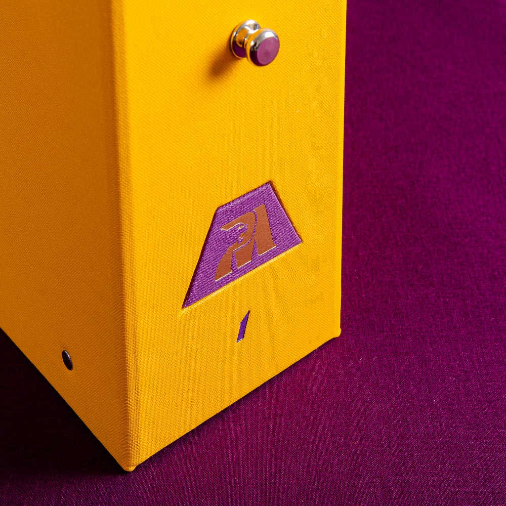 purple gold foil plaque on yellow ring binder on purple back ground - Gallery image 6