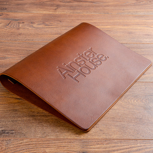 Beautiful leather menu cover with logo embossed vertically on the cover