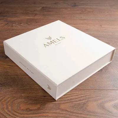 Custom made clamshell presentation box for luxury yacht builder personalised with gold foil embossed logos