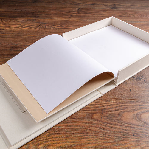 Open book sitting in custom made presentation box hand crafted by Hartnack & Co.