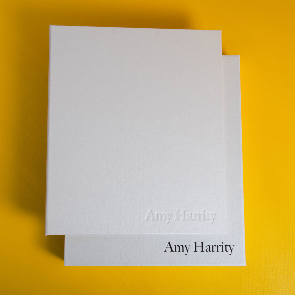 high quality personalised photography book in white fabric with black foiled logo on yellow back ground by hartnack and co - Gallery image 4